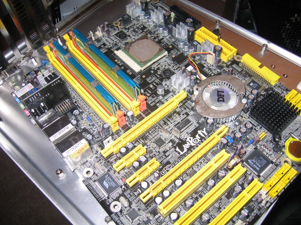 DFI LANParty UT CFX3200-DR, just after it was broken down for rebuilding.